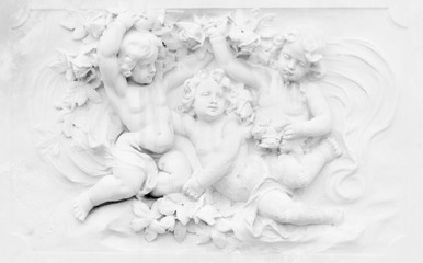 Black and white photography of basrelief with cherubs