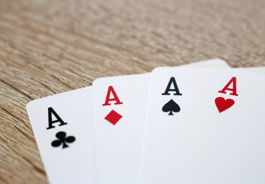 Poker game with aces, four of a kind
