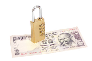 Combination padlock on Indian currency rupee