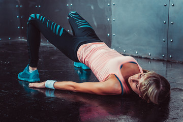 Bridge pose sporty woman doing fitness workout yoga stretching