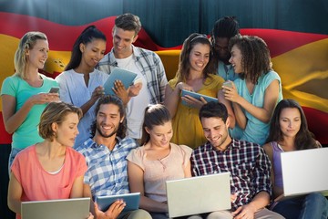 Composite image of several students using electronic devices