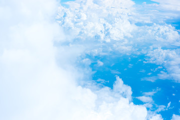 Aerial view of Blue sky and Cloud Top view from airplane window,