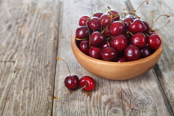 Ripe cherry in a wooden bowl