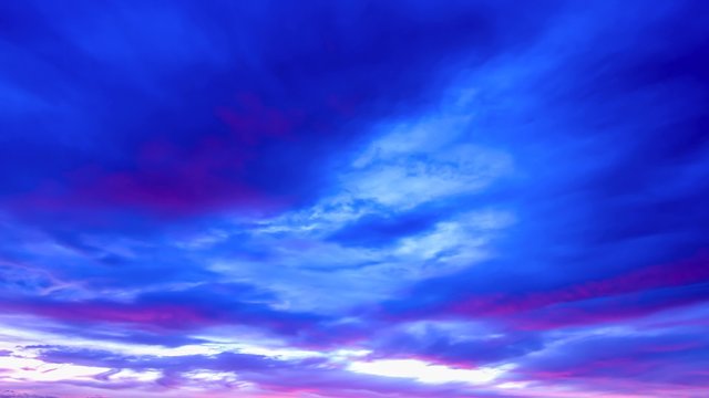 Timelapse of a colorful cloudy sky at sunset.
