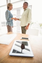 Obraz premium Two business colleagues shaking hands