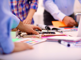 Fototapeta premium Young business people working at office on new project