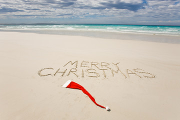 Merry Christmas written on a tropical beach