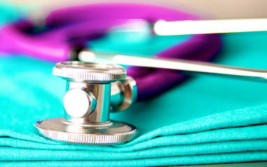Medical stethoscope rests on a uniform close-up