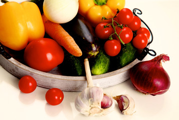 Composition with assorted raw organic vegetables wooden table