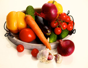 Farm Vegetables lie on a wooden table waiting for cooking