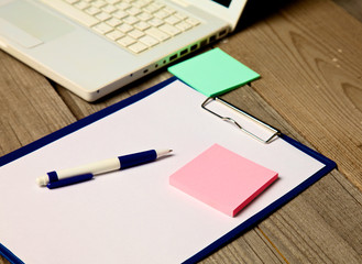 office desk with a laptop and a tablet