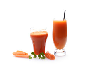 Carrot juice and slices of carrot on white