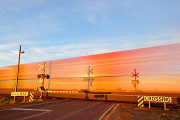 Fototapeta premium Blur of a train at a crossing. Pimba. South Australia.