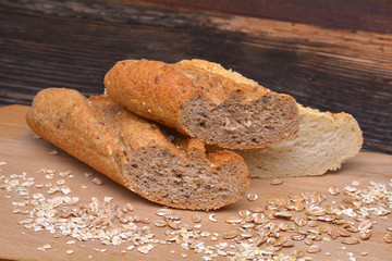 Bread and  grains on wooden background