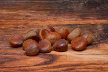 Chestnuts on wooden background
