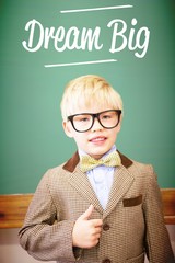 Dream big against cute pupil dressed up as teacher in classroom