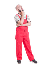 Fototapeta premium Plumber or mechanic thinking and looking up