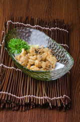 japanese cuisine. fried squid on the background