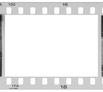 A grungy black and white negative 35mm film frame. Intentional dust and scratches. Opening for image.