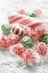 Christmas bonbons and candy canes in icing sugar