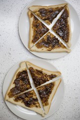 Slices of Vegemite & bread (quartered, yeast extract spread, Australia)