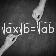 Composite image of hand writing with chalk