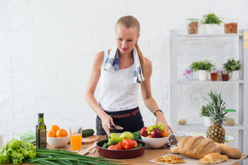 Woman preparing dinner in a kitchen concept cooking, culinary