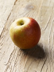 An apple on a wooden background