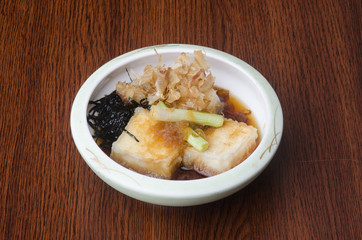 japanese cuisine. fried tofu on the background