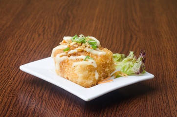 japanese cuisine. fried tofu on the background