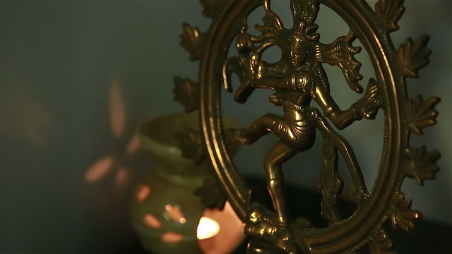 Traditional Indian statue of the dancing Shiva on the altar in the temple.
