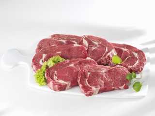 Entrecote steaks on ceramic chopping board