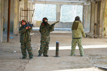 Fototapeta premium boys playing with gun during laser tag
