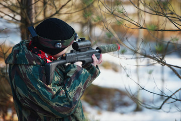 Fototapeta premium boys playing with gun during laser tag