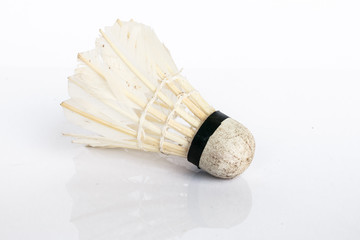 Old shuttle cock on white background.