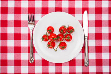 Cherry tomatoes launch on white plate