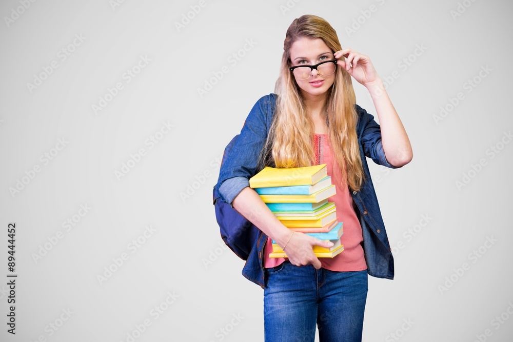 Canvas Prints Composite image of pretty student in the library