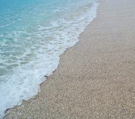 sand beach and blue wave sea