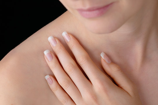 Young beauty with polished finger nails