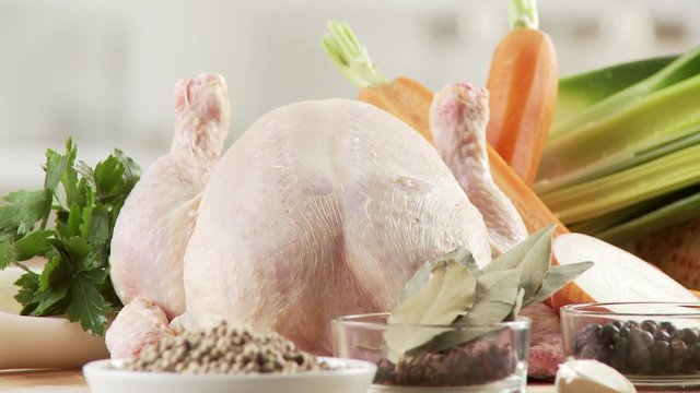 Ingredients for chicken soup: chicken, spices, mirepoix