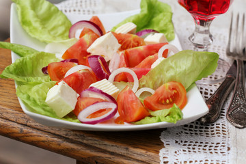 salad with lettuce, goat cheese and tomatoes