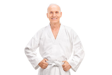 Joyful senior in a white kimono with a white belt