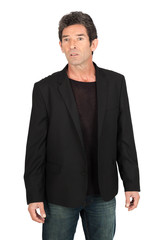 Handsome man doing different expressions in different sets of clothes: worried