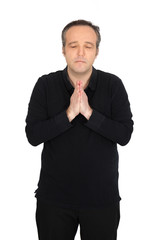 Handsome man doing different expressions in different sets of clothes: praying