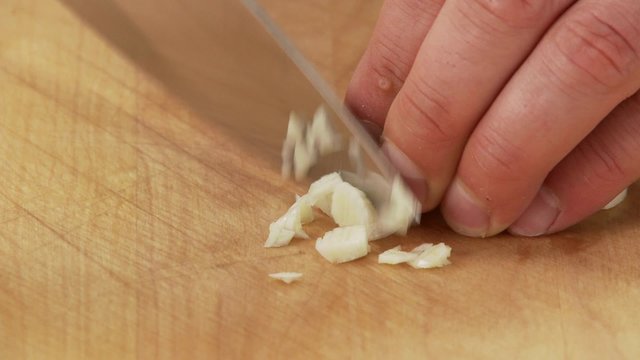 Chopping a garlic clove