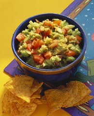 Guacamole with pieces of tomato