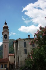Fototapeta na wymiar Menaggio - Church bell tower of Santo Stefano at Lake Como under blue sky, Italy 