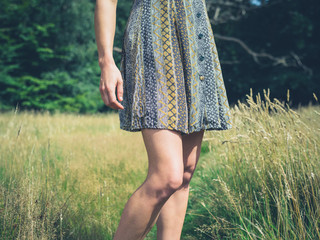 Young woman standing in meadow