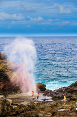 Pacific ocean waves hitting the rocky coastline of Maui, Hawaii,