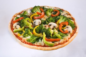 A vegetable pizza with broccoli, pepper and mushrooms